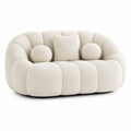 Sofá de dos plazas en tela bouclé beige