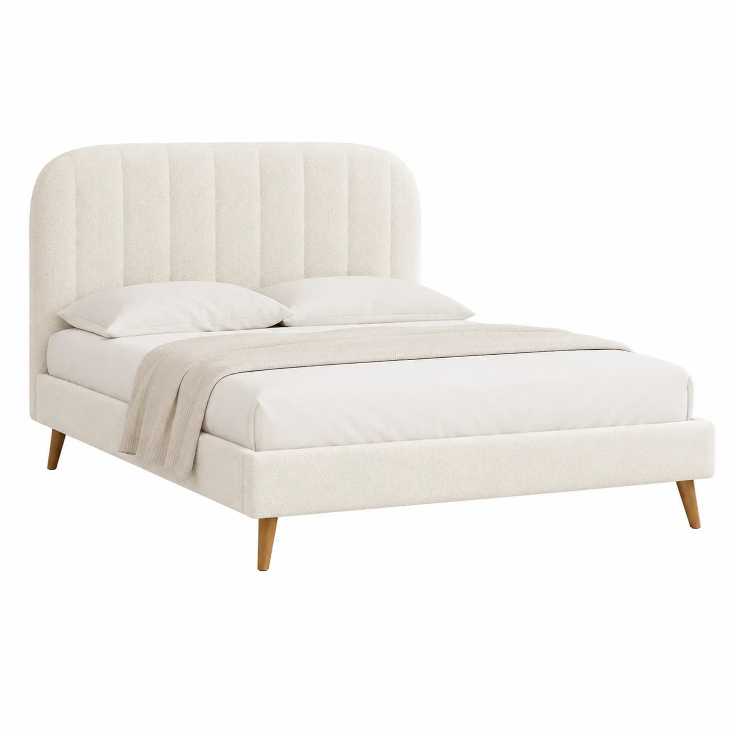 Cama tapizada de tela beige con cabecera curva y patas de madera
